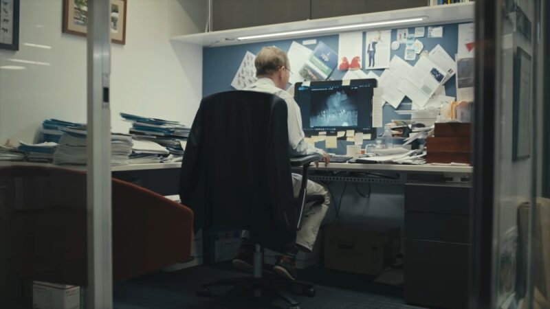 Older Man Working on Computer on Saving Biodiversity