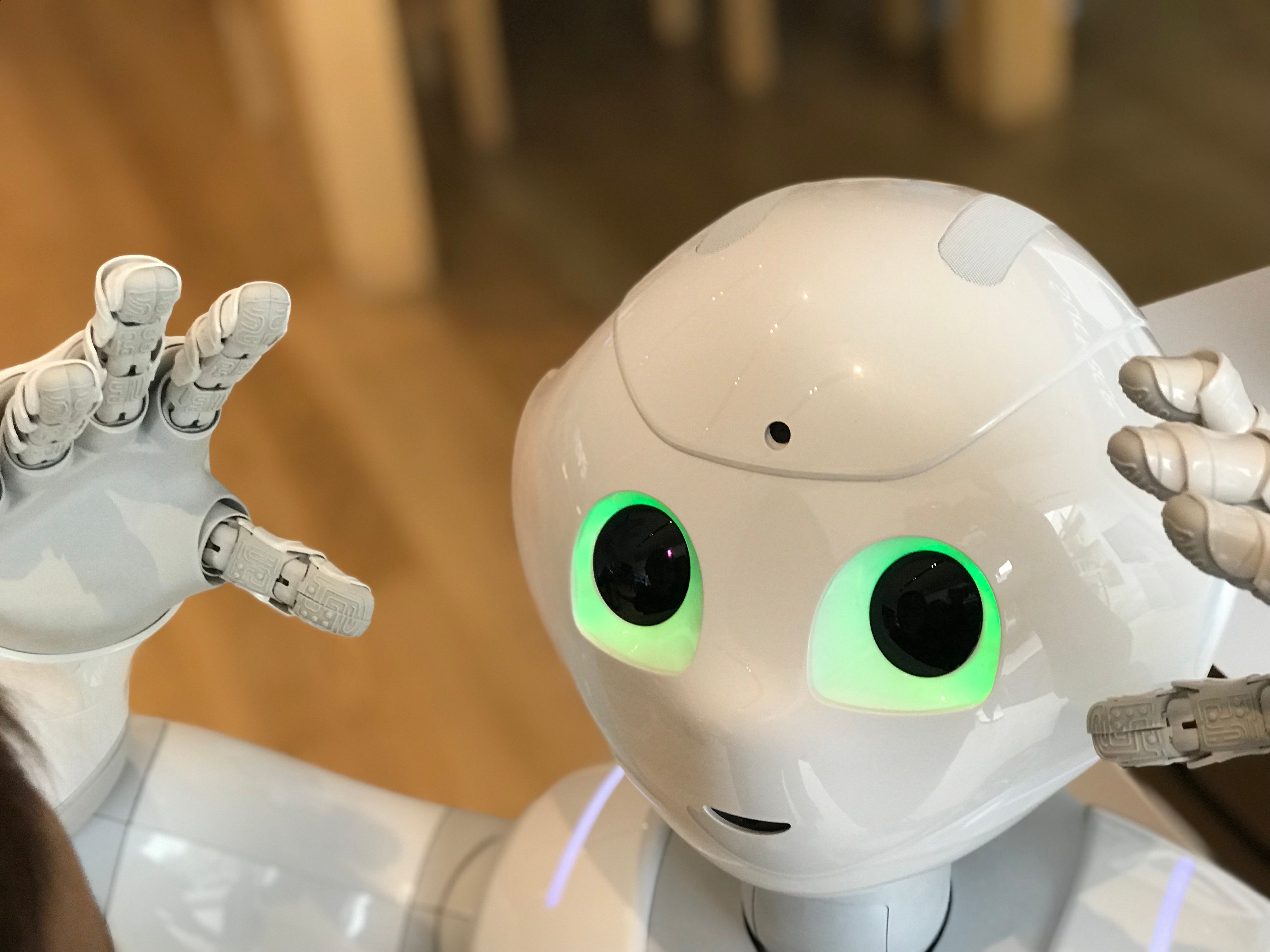 Futuristic humanoid robot companion with glowing eyes representing AI companionship